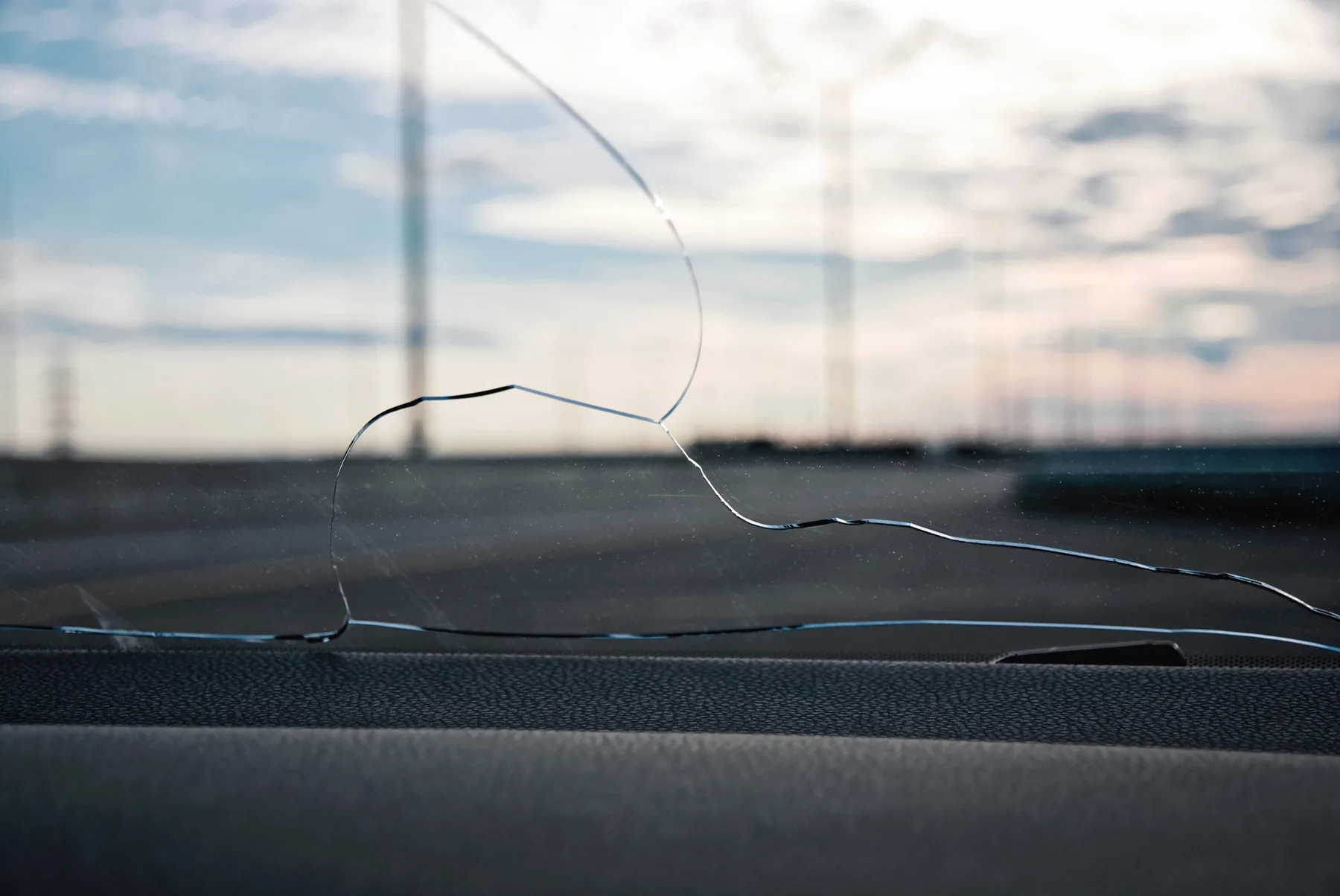 Small windshield crack close-up before repair